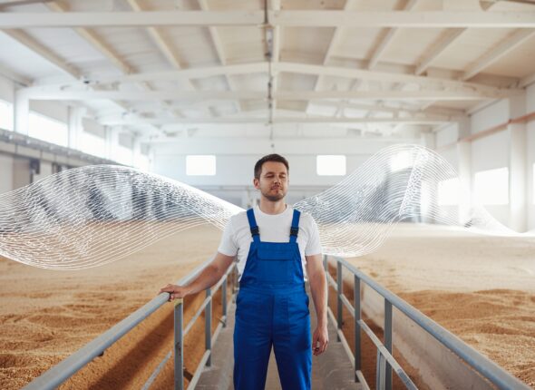 Firefly_Illustrative industrial scene inside a flour mill where an experienced operator stand 446919